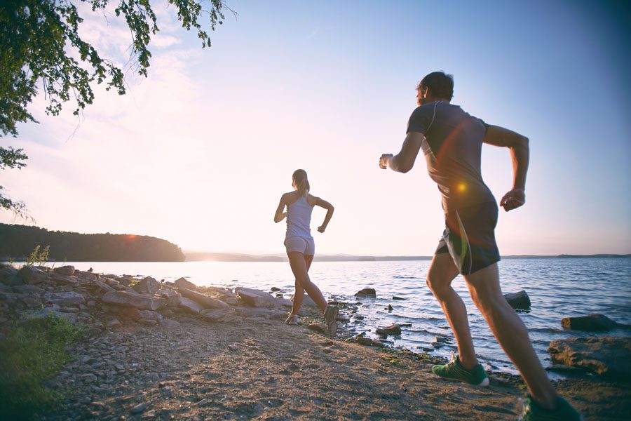 Header - Employee Benefits People Running by Lake